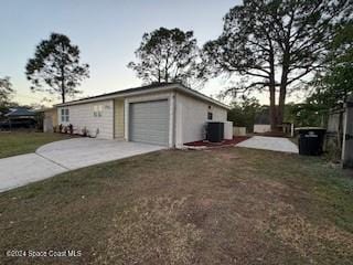 view of side of property with a lawn and central AC unit