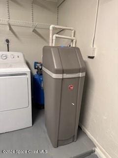 clothes washing area featuring washer and clothes dryer