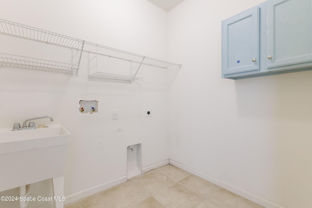 2342 Planter Ridge Ct, Palm Bay, FL 32909 - laundry area with cabinet space, hookup for an electric dryer, washer hookup, and light tile patterned floors