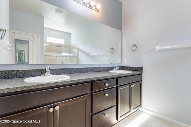 2342 Planter Ridge Ct, Palm Bay, FL 32909 - full bath with double vanity, a shower stall, and tile patterned flooring
