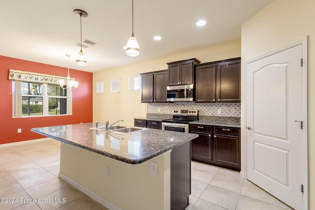 2342 Planter Ridge Ct, Palm Bay, FL 32909 - kitchen featuring appliances with stainless steel finishes, backsplash, light tile patterned floors, dark brown cabinetry, and recessed lighting