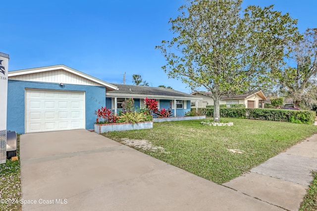 ranch-style house with a garage and a front lawn