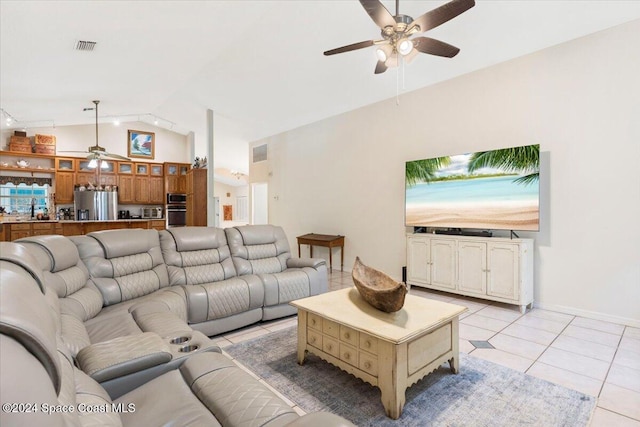 living room featuring light tile patterned floors, ceiling fan, and lofted ceiling