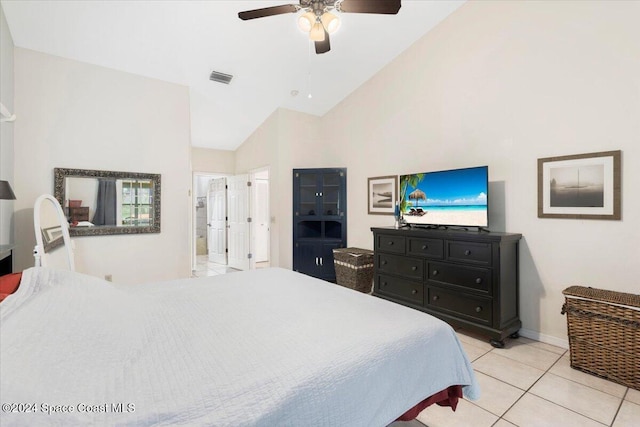 tiled bedroom featuring connected bathroom, ceiling fan, and high vaulted ceiling