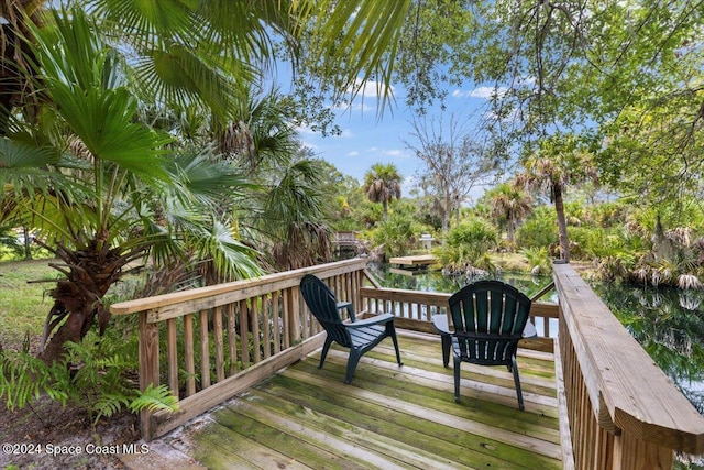 deck featuring a water view