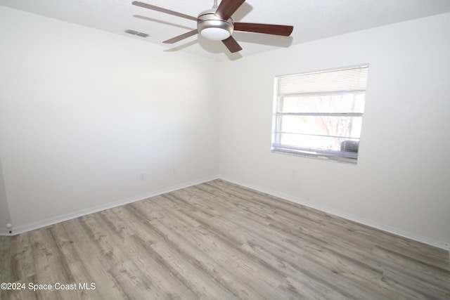 unfurnished room featuring ceiling fan and light hardwood / wood-style floors