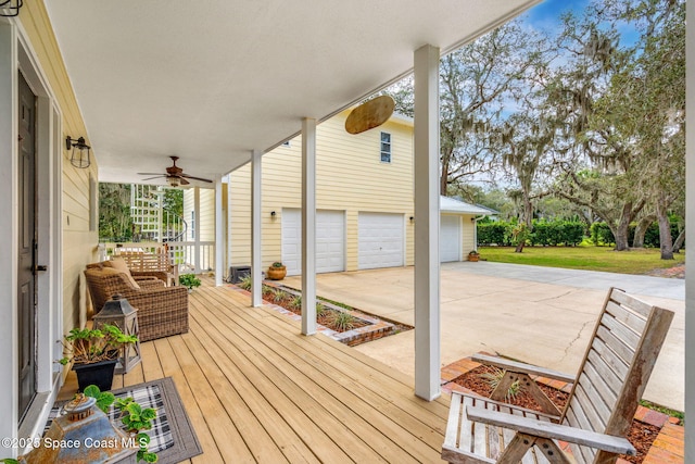 wooden terrace featuring ceiling fan