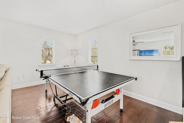 game room with dark hardwood / wood-style floors