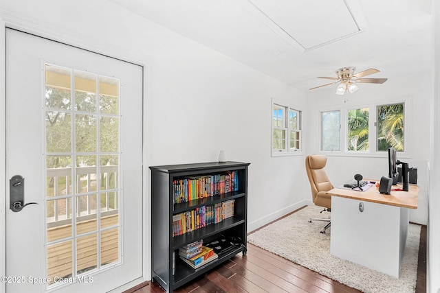 office with ceiling fan and dark wood-type flooring