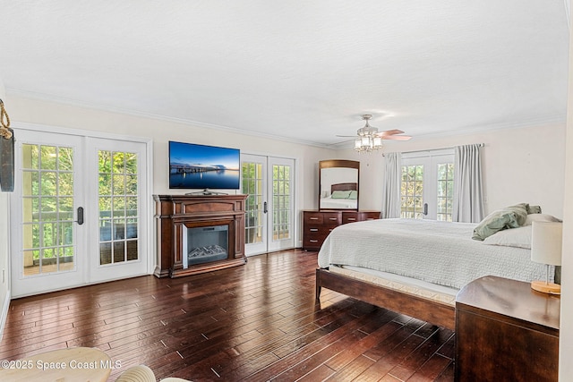 bedroom with ceiling fan, dark hardwood / wood-style flooring, access to outside, and french doors