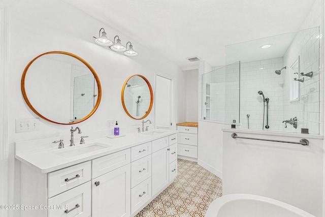 bathroom featuring vanity and a tile shower