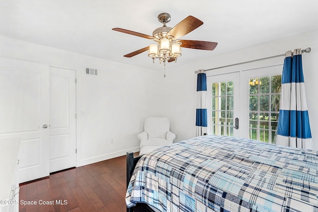 bedroom with ceiling fan and dark hardwood / wood-style flooring