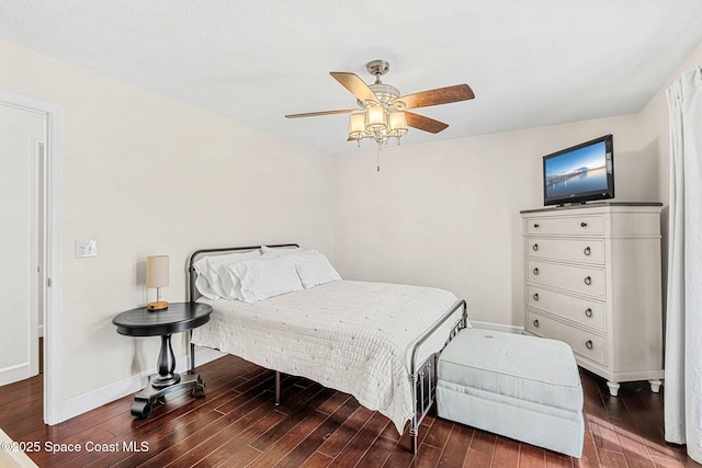 bedroom with dark hardwood / wood-style floors and ceiling fan