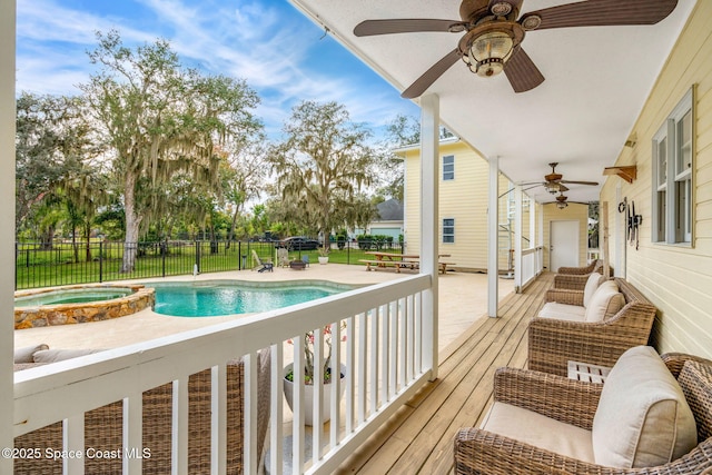 view of swimming pool featuring an in ground hot tub