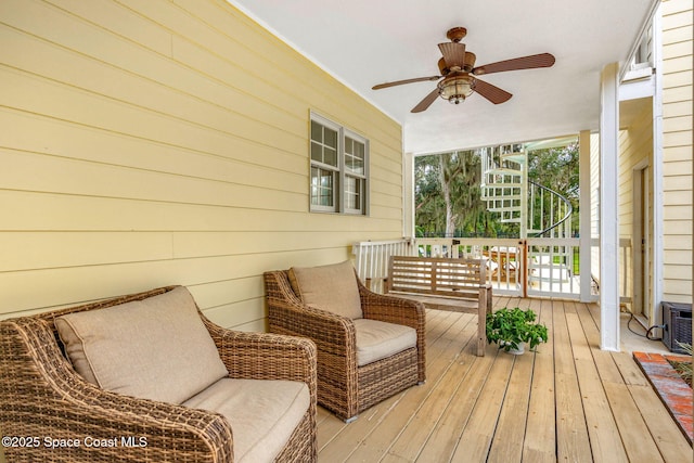 wooden deck with ceiling fan and covered porch