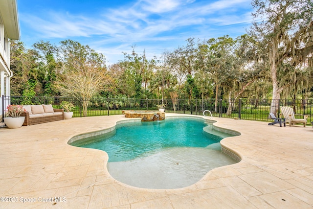 view of swimming pool featuring an in ground hot tub and a patio