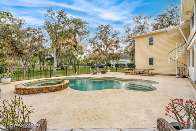 view of pool with an in ground hot tub and a patio