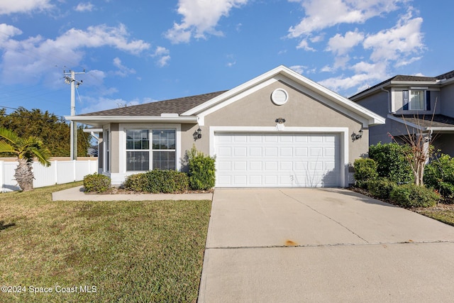 1796 Alaqua Way, Melbourne, FL 32904 - view of front of property with stucco siding, driveway, and an attached garage