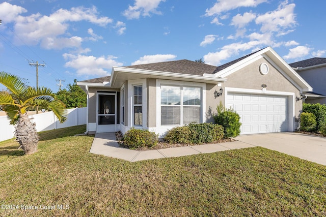 view of front facade with a front lawn and a garage