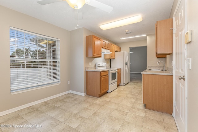 1796 Alaqua Way, Melbourne, FL 32904 - kitchen with white appliances, under cabinet range hood, light countertops, and a ceiling fan