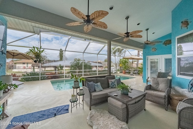 view of patio / terrace featuring an outdoor living space, a lanai, a fenced in pool, and ceiling fan