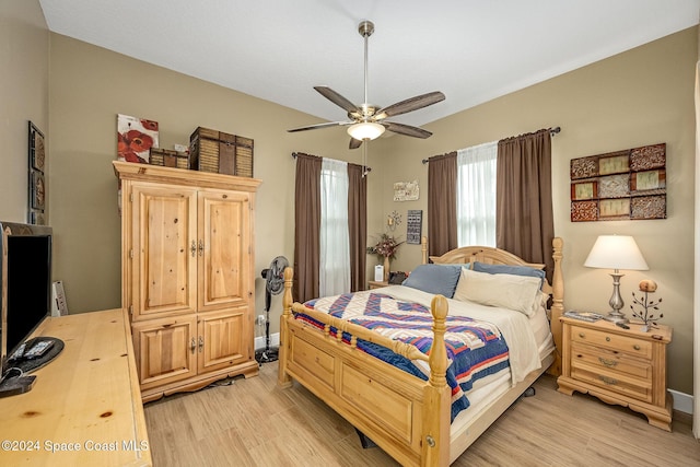 bedroom with ceiling fan and light hardwood / wood-style flooring