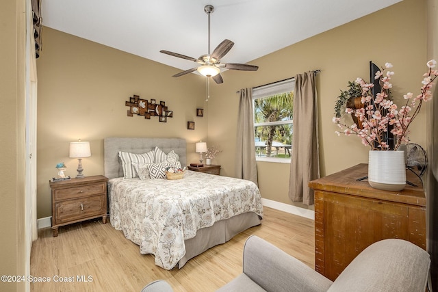 bedroom with ceiling fan and light wood-type flooring