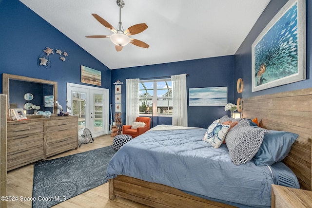 bedroom featuring light hardwood / wood-style flooring, ceiling fan, vaulted ceiling, access to outside, and french doors