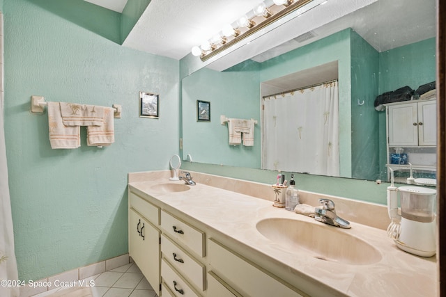 bathroom featuring tile patterned floors and vanity