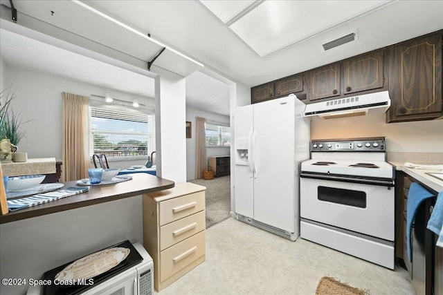 kitchen featuring dark brown cabinetry and white appliances