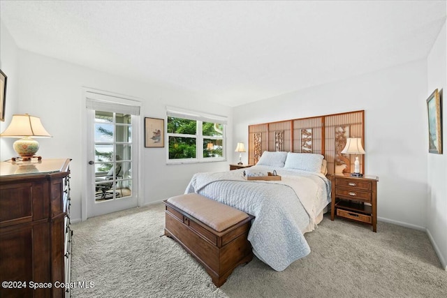 bedroom with light colored carpet