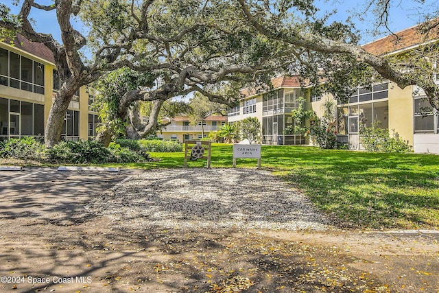 view of property's community with a yard