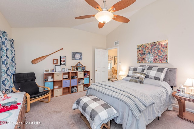 bedroom featuring carpet, ceiling fan, and vaulted ceiling