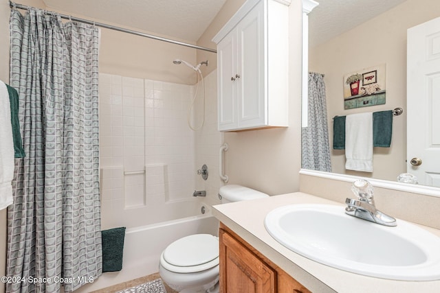 full bathroom featuring vanity, shower / bathtub combination with curtain, a textured ceiling, and toilet