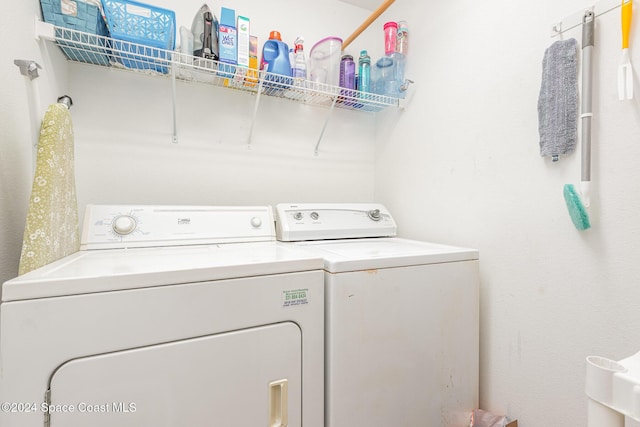 laundry room featuring washer and clothes dryer