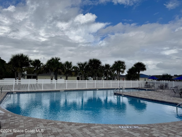 view of pool featuring a patio area