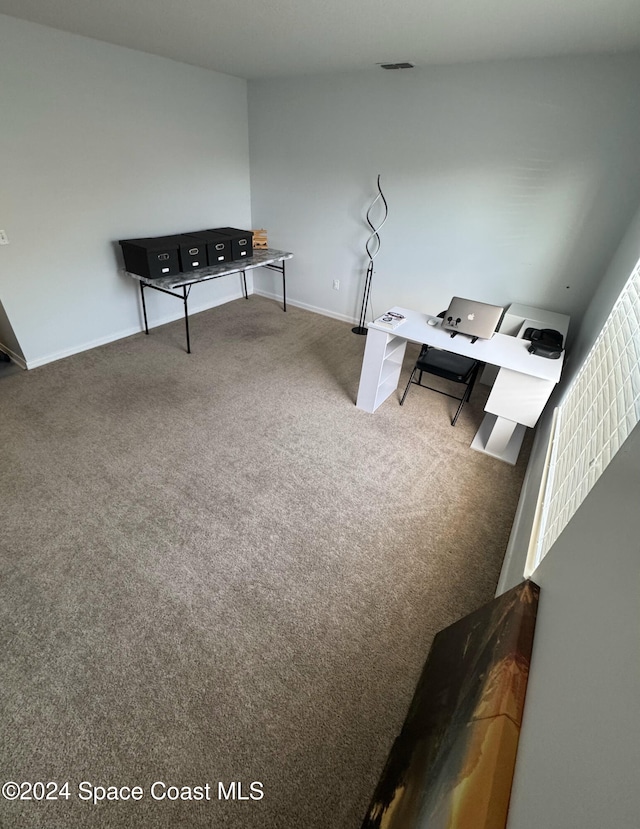 interior space featuring carpet and lofted ceiling