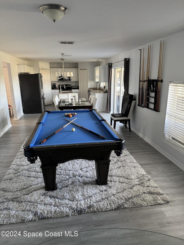 rec room with plenty of natural light, dark wood-type flooring, and billiards