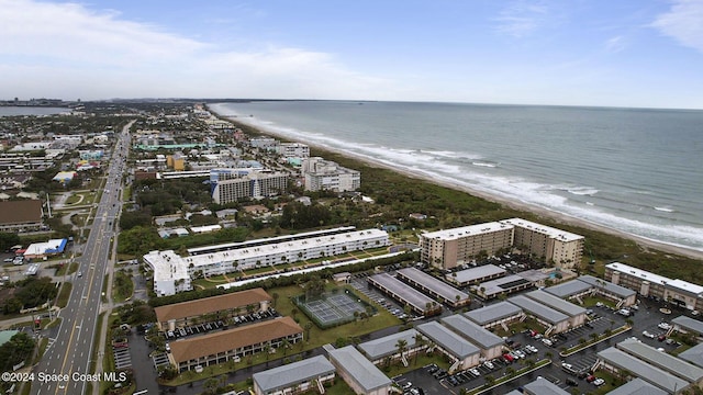 drone / aerial view featuring a view of the beach and a water view