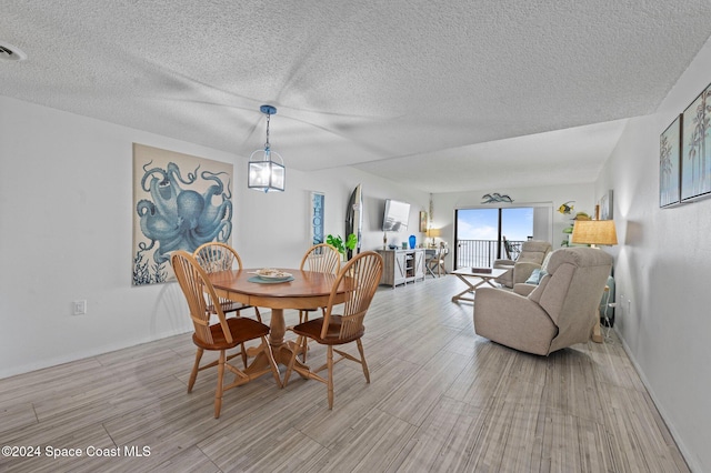 dining space featuring light hardwood / wood-style floors