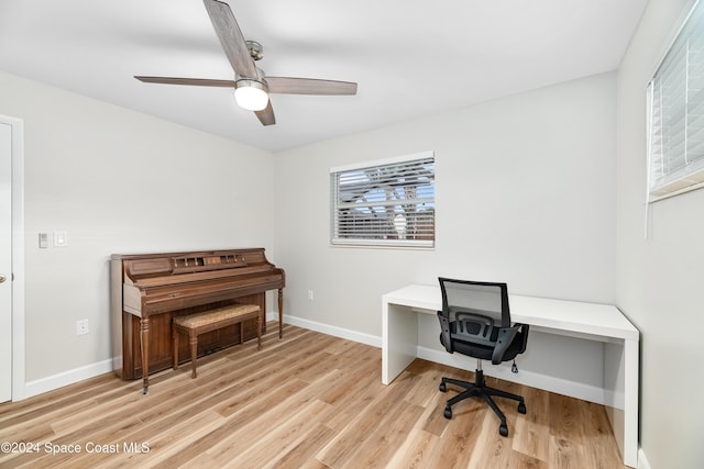 office space with ceiling fan and light wood-type flooring