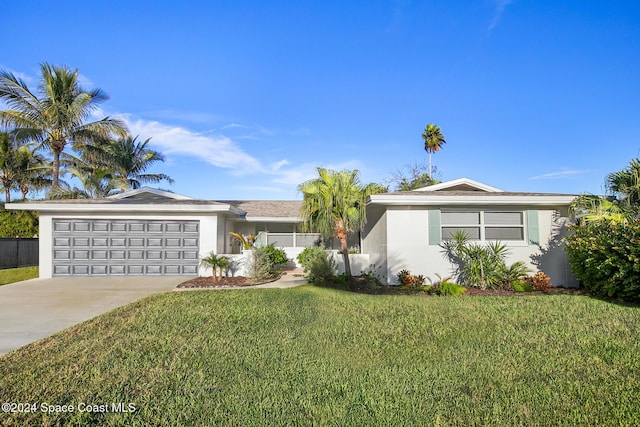 ranch-style home featuring a front lawn and a garage