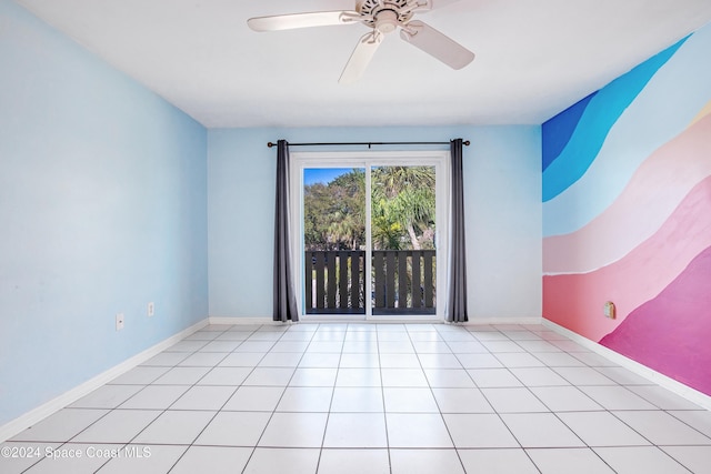 empty room with light tile patterned floors and ceiling fan