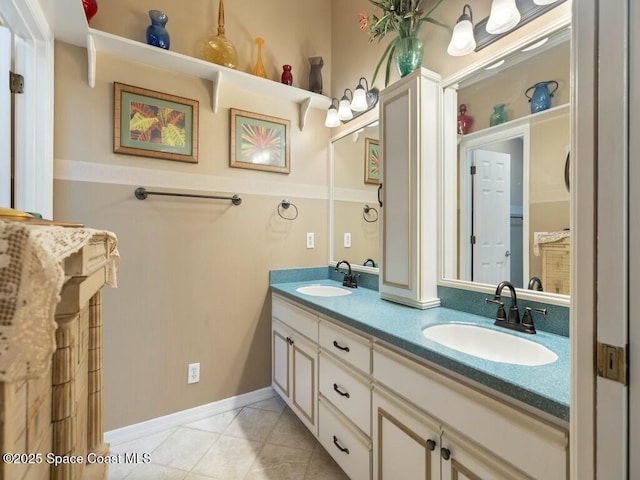 bathroom with tile patterned floors and vanity