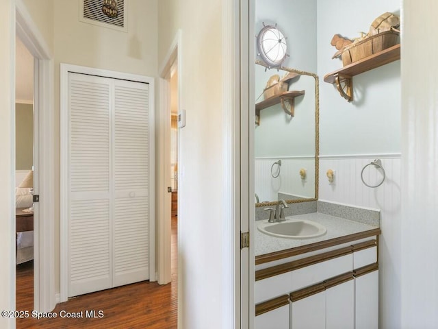 bathroom featuring vanity and hardwood / wood-style flooring