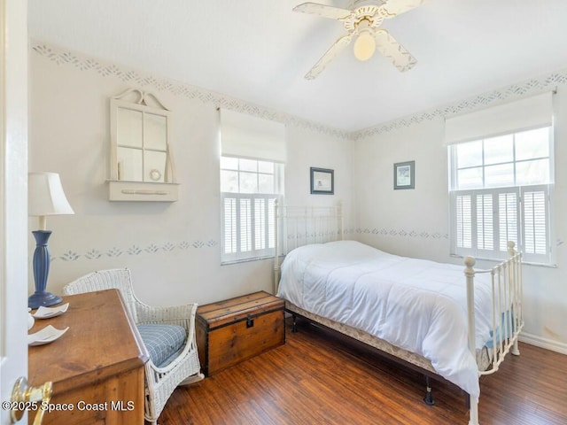 bedroom featuring wood-type flooring and ceiling fan