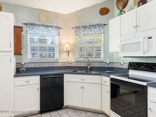 kitchen with black appliances, white cabinetry, and sink