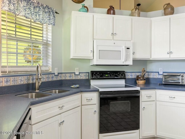 kitchen with electric range, dishwashing machine, white cabinets, and sink