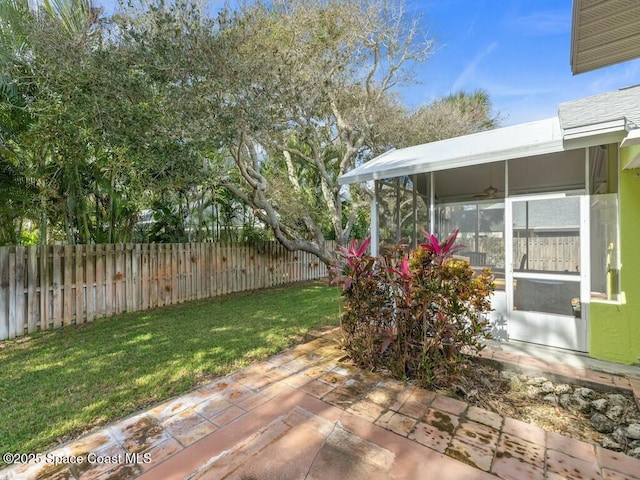 view of yard with a patio and a sunroom