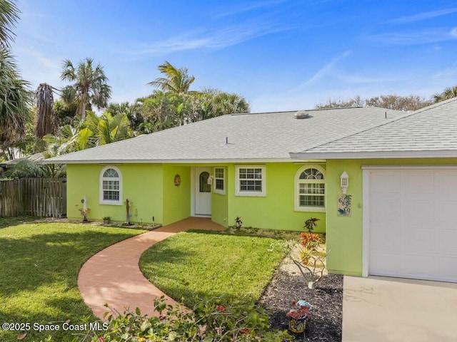 single story home with a garage and a front lawn